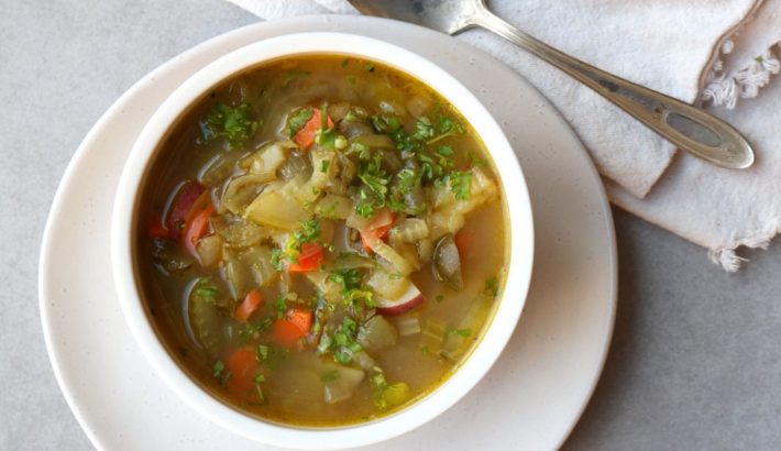 Pickle soup with potatoes, carrot, pepper and onions