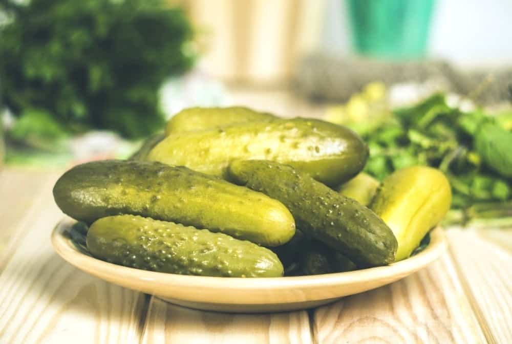 Pickled cucumbers are on the plate